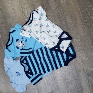 Gerber's 4 pk blue Onsies with 3 dogs and one blue striped.